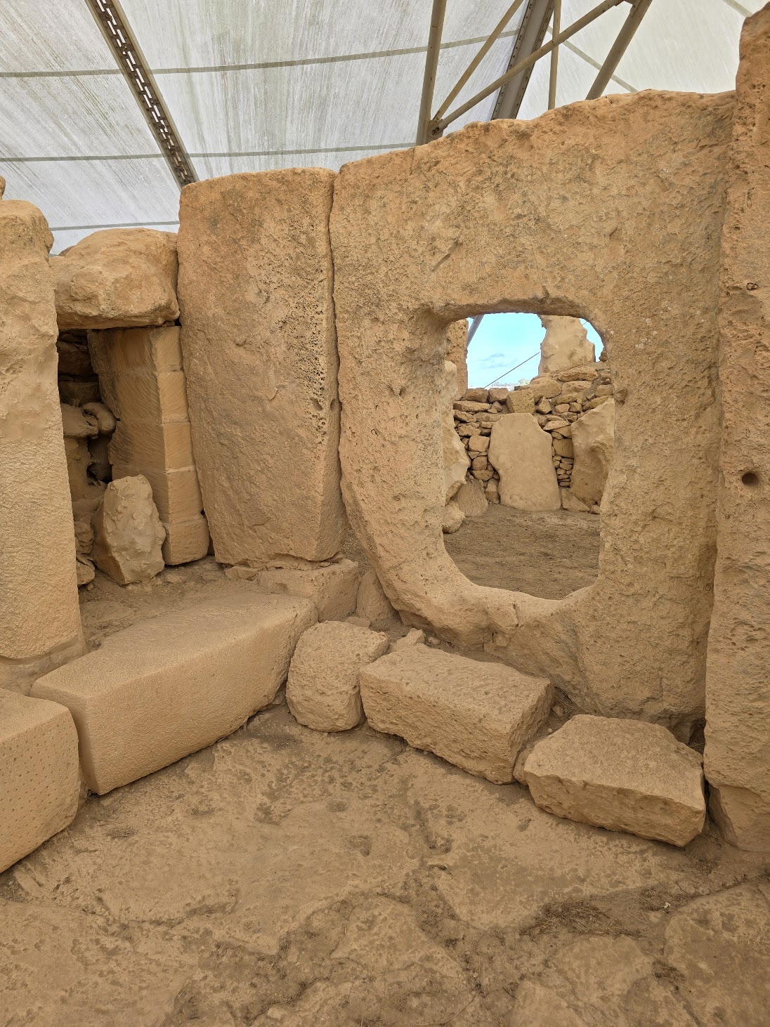 Ancient megalithic doorway at Hagar Qim temple complex, older than Stonehenge, visited during a cultural itinerary.