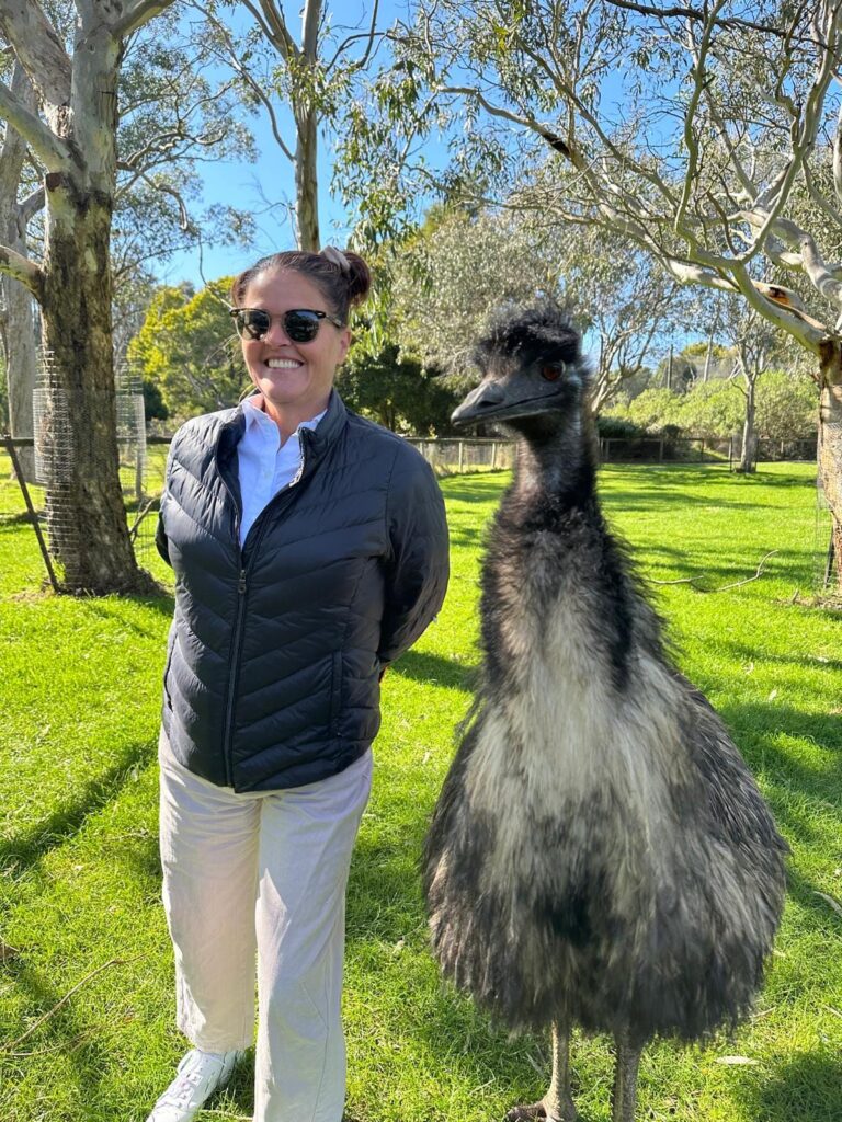Cathy Rowland standing next to an emu at Cleland Wildlife Park in the Adelaide Hills during a South Australia wildlife visit.