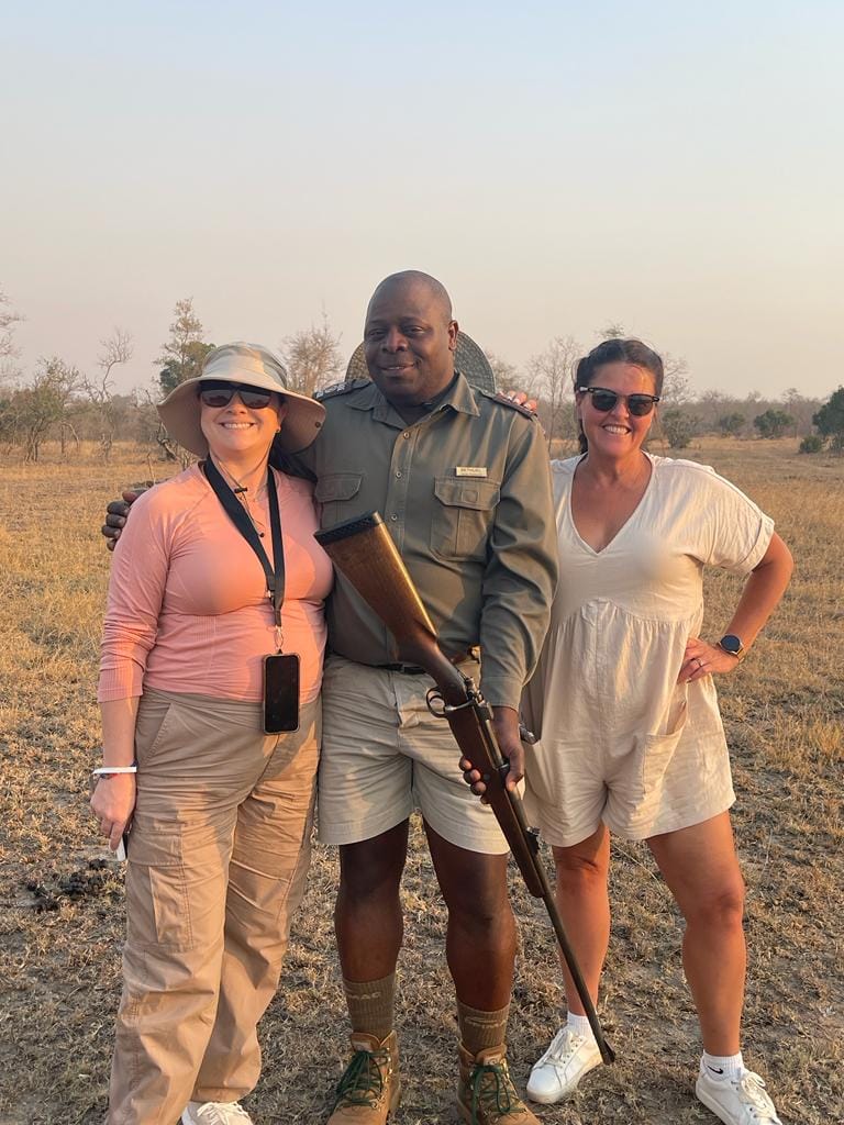 Luxury safari experience in South Africa with travelers and safari guide at Sabi Sabi Private Game Reserve during an African wildlife safari.