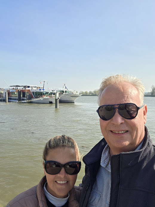 Luxury travel advisor exploring European river cruising with ships docked along the Seine River in France