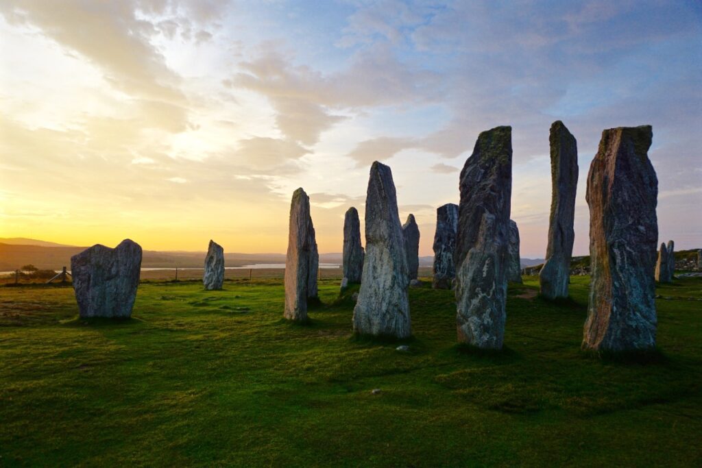 Standing stones at golden hour in Scotland — the ancient, otherworldly landscapes that made Outlander fans book their flights